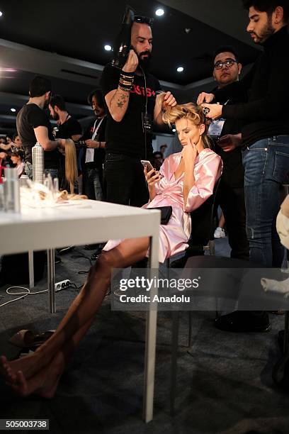 Victorias Secret model Michaela Kocianova gets ready backstage during the "Profundo Del Mar" fashion show within the Fashionist Dress, Wedding Dress...