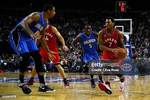 Kyle Lowry of the Toronto Raptors in action against Channing Frye of the Orlando Magic and Victor Oladipo of the Orlando Magic during the 2016 NBA...