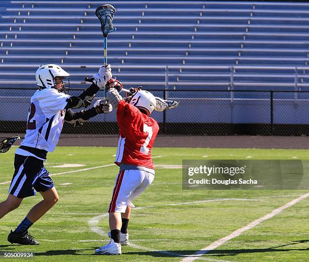 lacrosse game action - lacrosse stock-fotos und bilder