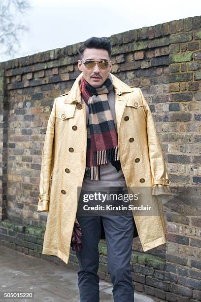 London Collections Men ambassador and model Hu Bing wears all Burberry "n on day 4 of London Collections: Men on Januay 11, 2016 in London, England....