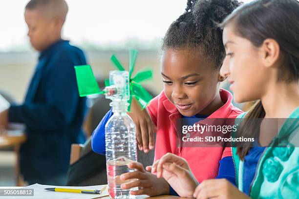 students building windmill during elementary science class - child creativity stock pictures, royalty-free photos & images