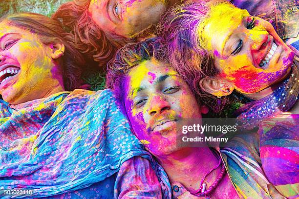 colorful faces holi festival india friends celebrating festival of colors - festival make up stock pictures, royalty-free photos & images