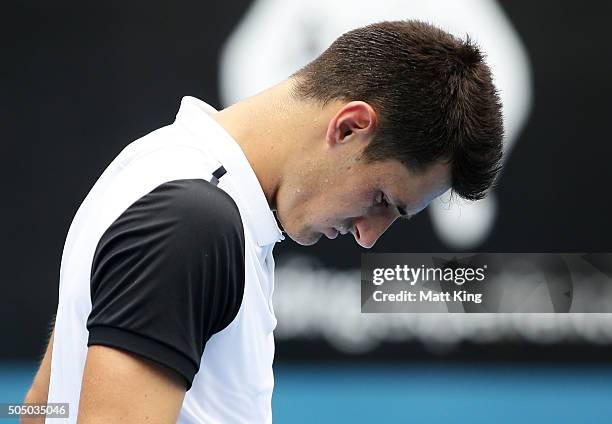 Bernard Tomic of Australia looks dejected as he forfeits his game against Teymuraz Gabashvili of Russia during day six of the 2016 Sydney...