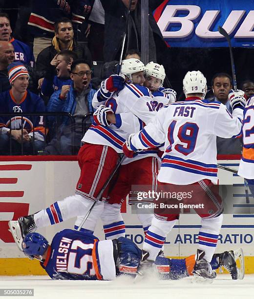 Marc Staal, Chris Kreider and Jesper Fast of the New York Rangers celebrate Kreider's goal at 19:14 of the second period against the New York...