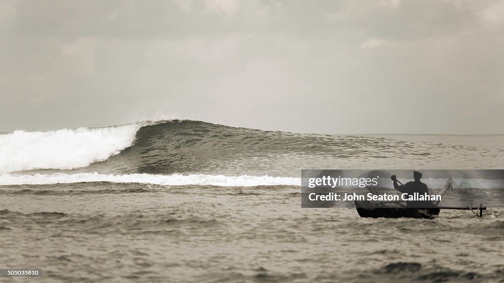 Indian ocean wave and fisherman