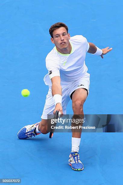 Pablo Carreno Busta of Spain plays a backhand in his match against Gilles Simon of France during day four of the 2016 Kooyong Classic at Kooyong on...