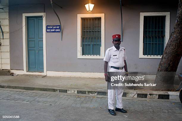 Police personnel poses for a photograph on a road in Puducherry. Puducherry, formerly known as Pondicherry is a Union Territory of India. In 1674,...