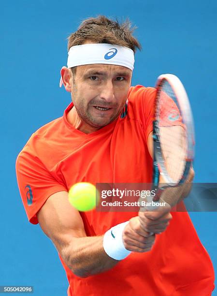 Marinko Matosevic of Australia plays a backhand in his match against Alejandro Gonzalez of Colombia during round two of 2016 Australian Open...