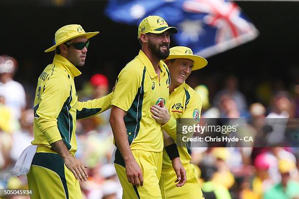 Kane Richardson of Australia celebrates with team mates after a throw that dismissed Virat Kohli of India with a run out during game two of the...