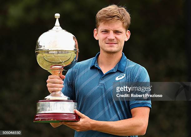 David Goffin of Belgium poses with the winners trophy after winning his match against Feliciano Lopez of Spain during day four of the 2016 Kooyong...