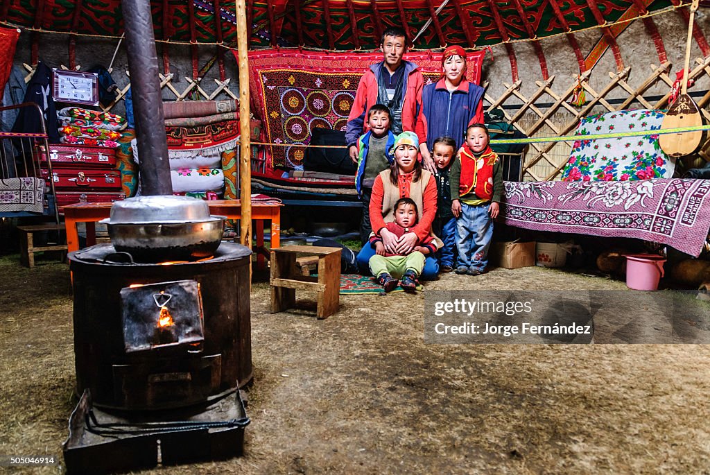 Mongolian family inside a yurt...