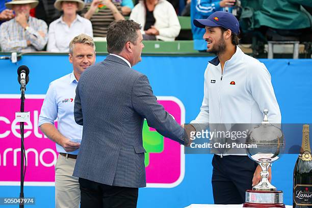 Stephen Roche hands Feliciano Lopez his runner's up trophy after the final of the 2016 Kooyong Classic on January 15, 2016 in Melbourne, Australia....