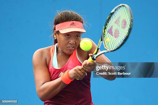 Naomi Osaka of Japan plays a backhand in her match against Alexandra Panova of Russia during round two of 2016 Australian Open Qualifying at...