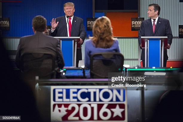 Donald Trump, president and chief executive of Trump Organization Inc. And 2016 Republican presidential candidate, left, speaks as Senator Ted Cruz,...