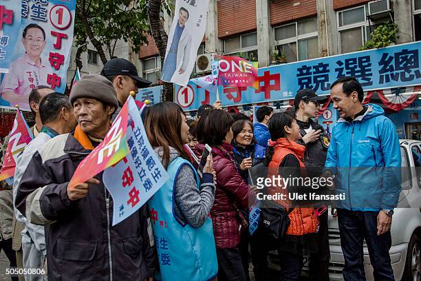 Kuomintang Party presidential candidate Eric Chu , shakehands with the supporters during rally campaign ahead of the Taiwanese presidential election...
