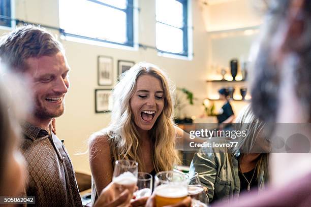 good waste of time with friends - friends in restaurant bar stockfoto's en -beelden