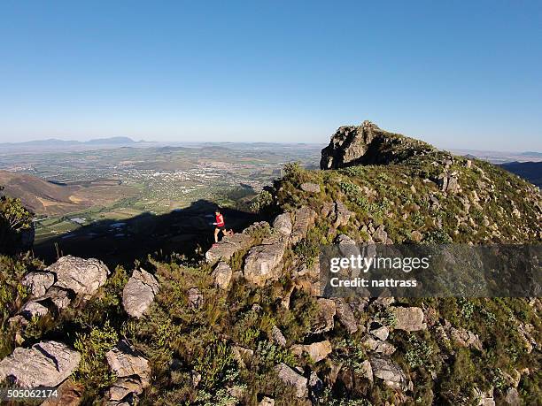 running on top of the mountain - reserve athlete stock pictures, royalty-free photos & images