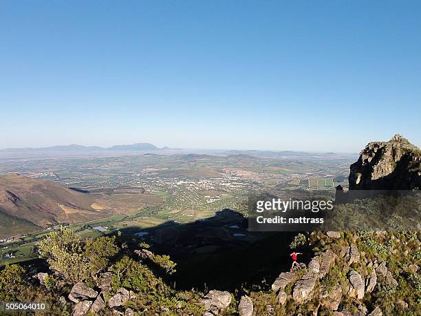 aerial shot of a male mountain running - reserve athlete stock pictures, royalty-free photos & images