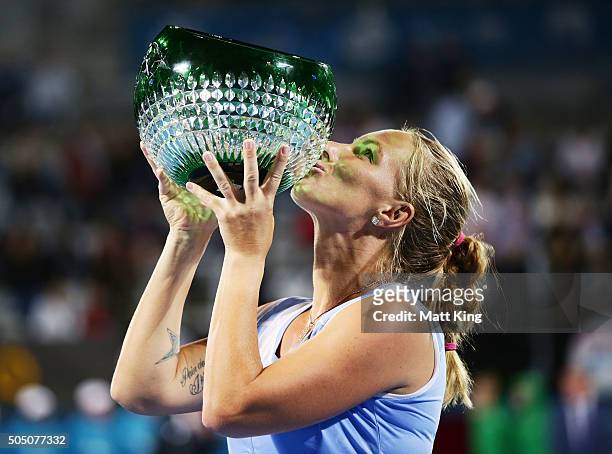 Svetlana Kuznetsova of Russia celebrates and holds aloft the winners trophy after winning the final match against Monica Puig of Puerto Rico day six...
