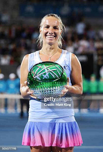 Svetlana Kuznetsova of Russia celebrates and holds aloft the winners trophy after winning the final match against Monica Puig of Puerto Rico day six...