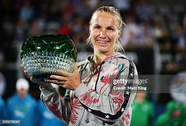 Svetlana Kuznetsova of Russia celebrates and holds aloft the winners trophy after winning the final match against Monica Puig of Puerto Rico day six...