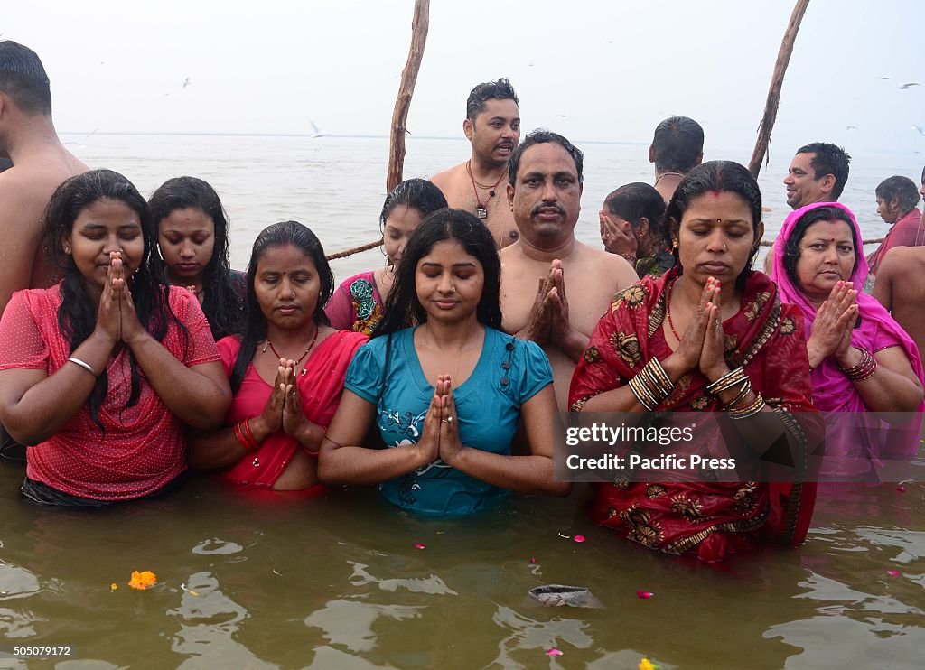 Devotees taking holydip at Sangam the confluence of River...