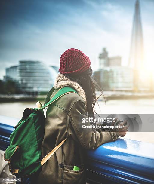 chinese tourist in london observing the skyline - london winter stockfoto's en -beelden