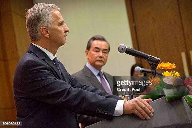 Swiss Foreign Minister Didier Burkhalter, left, speaks as Chinese Foreign Minister Wang Yi, right, listens during a joint press conference at the...