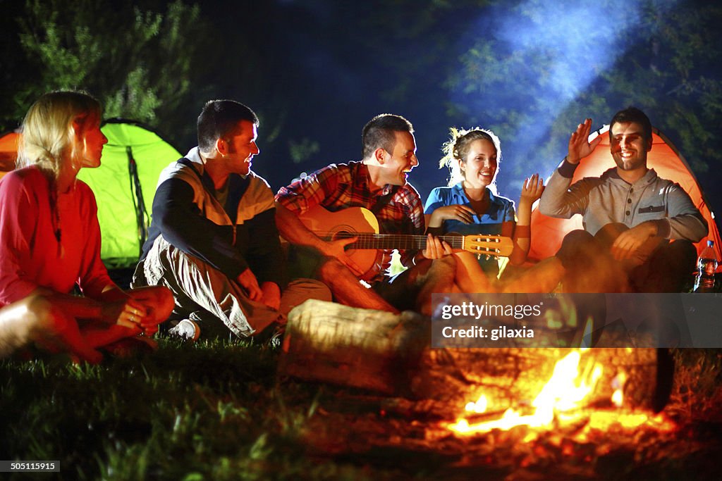 Campfire guitar session.