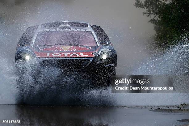 Sebastien Loeb of France and Daniel Elena of Monaco in the PEUGEOT 2008 DKR for TEAM PEUGEOT TOTAL compete on day 13 / stage twelve between San Juan...