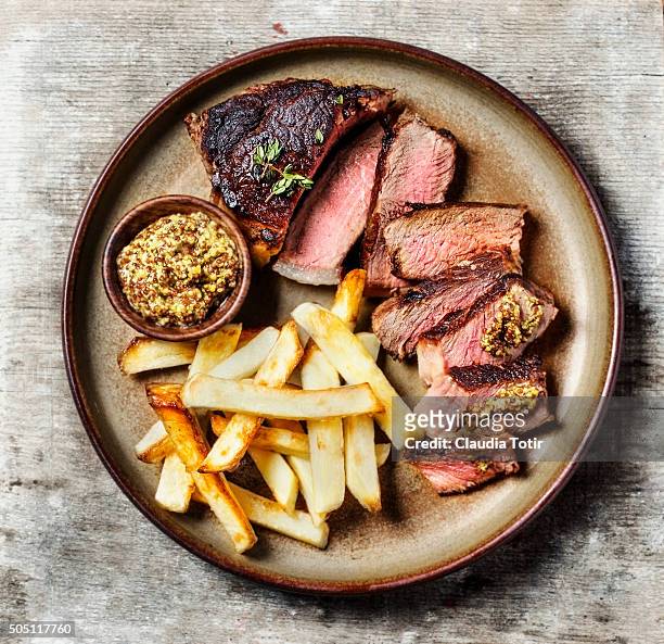 steak with french fries - steak plate stock pictures, royalty-free photos & images