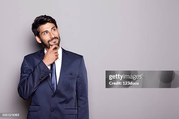 middle eastern businessman thinking - buisnessman studio clipping path stock pictures, royalty-free photos & images