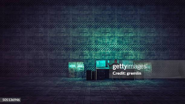 hacker in old warehouse - monitor wall stock pictures, royalty-free photos & images