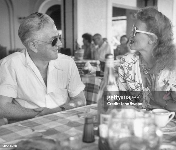 Anatole Litvak chatting with Mrs. Harold Ross, wife of the the New Yorker editor.