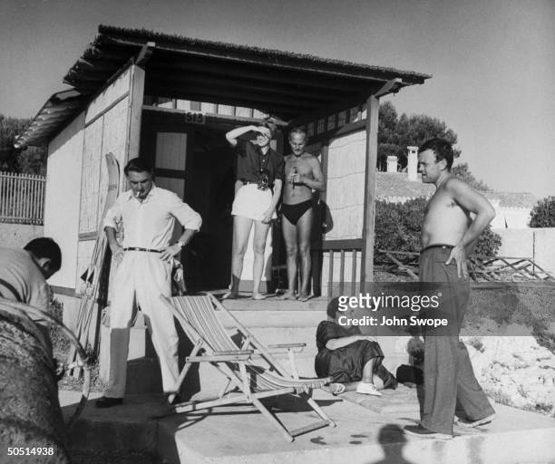 Agent Charles Feldman, Jean Howard, Darryl Zanuck, Elsa Maxwell and Orson Wells out side Darryl Zanuck's Cabana.