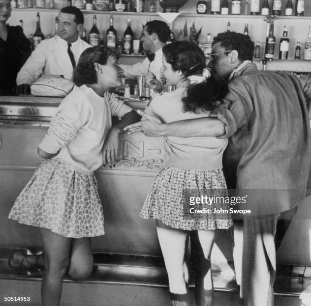 Young french people at the bar of Eden Roc.