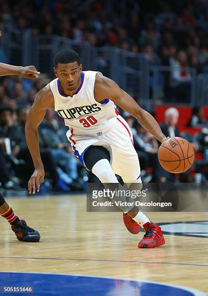 Wilcox of the Los Angeles Clippers dribbles to the basket during the NBA game against the Miami Heat at Staples Center on January 13, 2016 in Los...