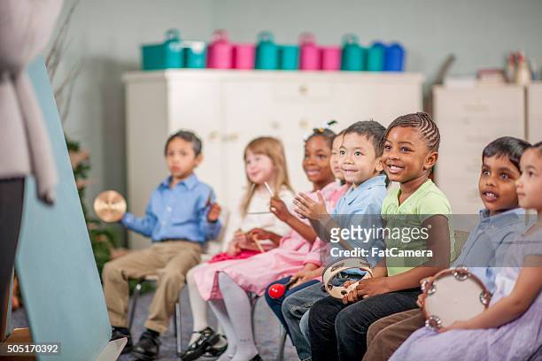 children making music at school - children music stock pictures, royalty-free photos & images