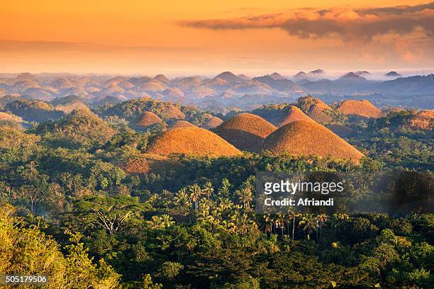 the chocolate hills in the morning - bohol philippines stock pictures, royalty-free photos & images