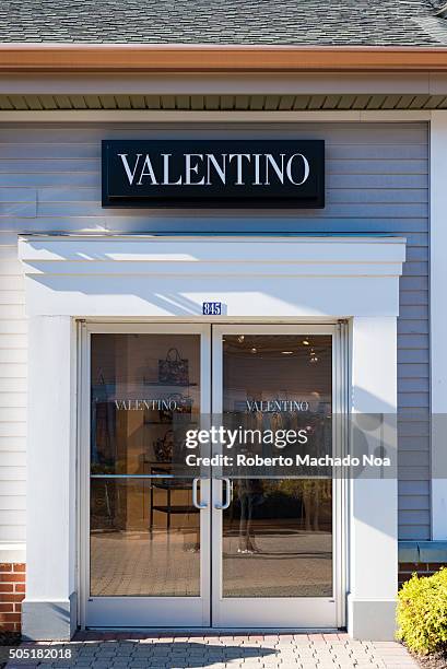 Shops in USA: Valentino store in New York city. The store sells designer dresses for women designed by the famous fashion designer Valentino....