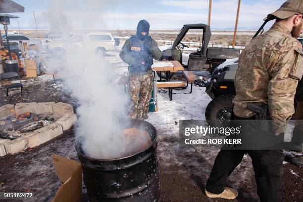 Armed occupiers burn garbage and stay warm at the Malheur National Wildlife Refuge Headquarters in Burns, Oregon on January 15, 2016. They are part...