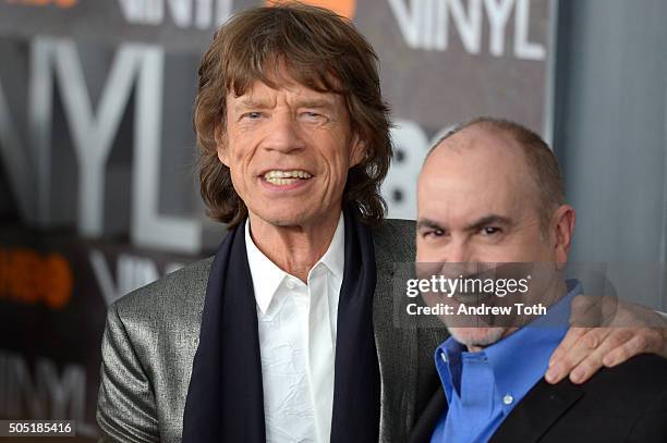 Mick Jagger and Terence Winter attend the "Vinyl" New York premiere at Ziegfeld Theatre on January 15, 2016 in New York City.