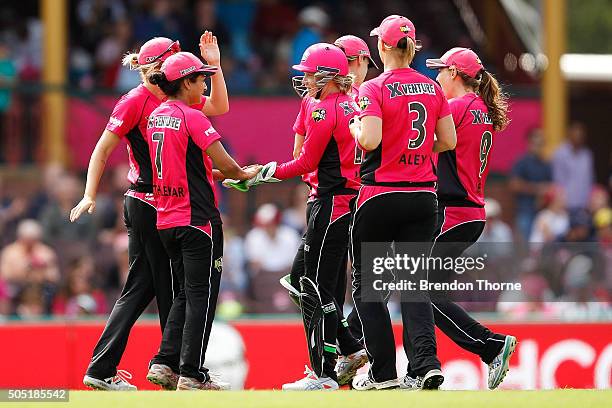 Lisa Sthalekar of the Sixers celebrates with team mates after claiming the wicket of Erin Osborne of the Thunder during the Women's Big Bash League...