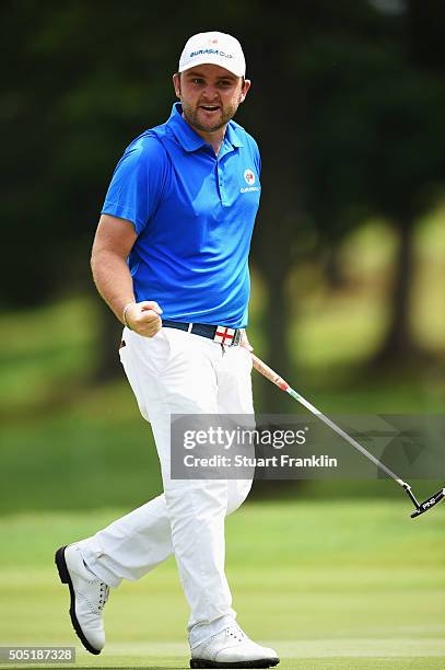 Andy Sullivan of team Europe celebrates a putt during thee second day's foursome matches at the EurAsia Cup presented by DRB-HICOM at Glenmarie G&CC...