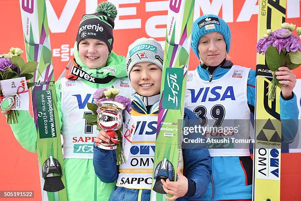 Ema Klinec of Slovenia , Sara Takanashi of Japan and Daniela Iraschko-Stolz of Austria pose on the podium after the 2nd round normal hill Individual...