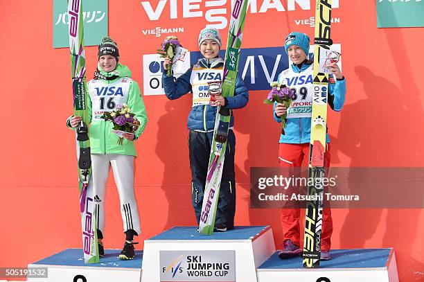 Ema Klinec of Slovenia , Sara Takanashi of Japan and Daniela Iraschko-Stolz of Austria pose on the podium after the 2nd round normal hill Individual...