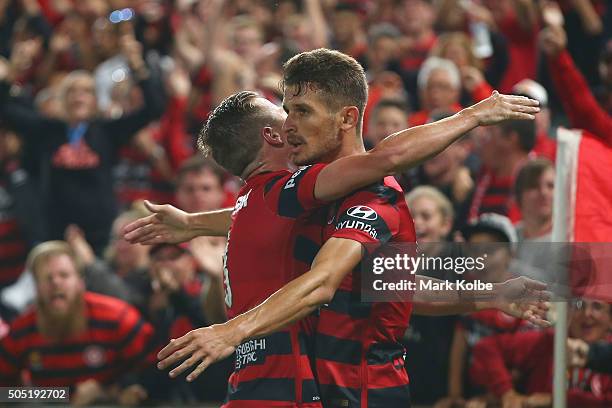Scott Neville of the Wanderers congratulates Dario Vidosic of the Wanderers as he celebrates scoring a goal during the round 15 A-League match...