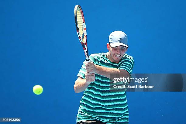 Dennis Novikov of the United States plays a backhand in his match against Yuichi Sugita of Japan during the third round of 2016 Australian Open...