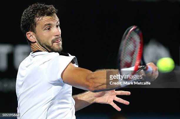 Grigor Dimitrov of Bulgaria plays a forehand in his men's final match against Viktor Troiki of Serbia during day seven of the 2016 Sydney...