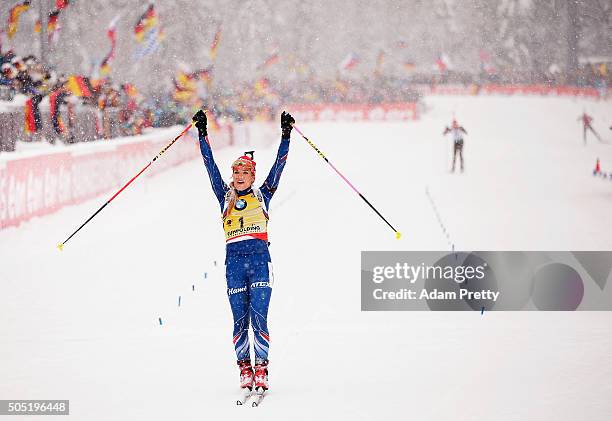 Gabriela Soukalova of the Czech Republic celebrates as she crosses the finish line to claim victory in the Women's 12.5km Biathlon race of the...